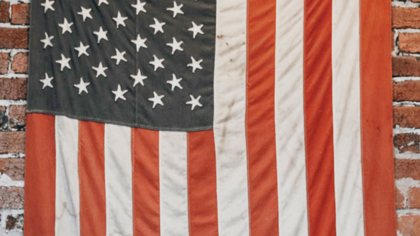 American Flag in front of Brick Wall
