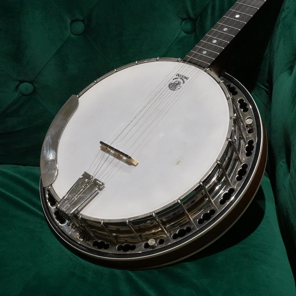 Banjo pot on green couch