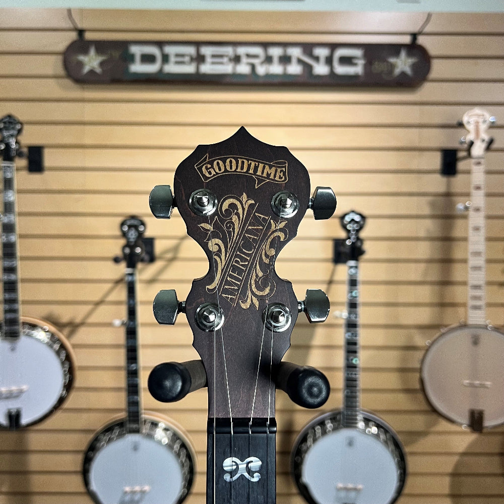 closeup photo of the peghead of this banjo showing that it has guitar style tuners