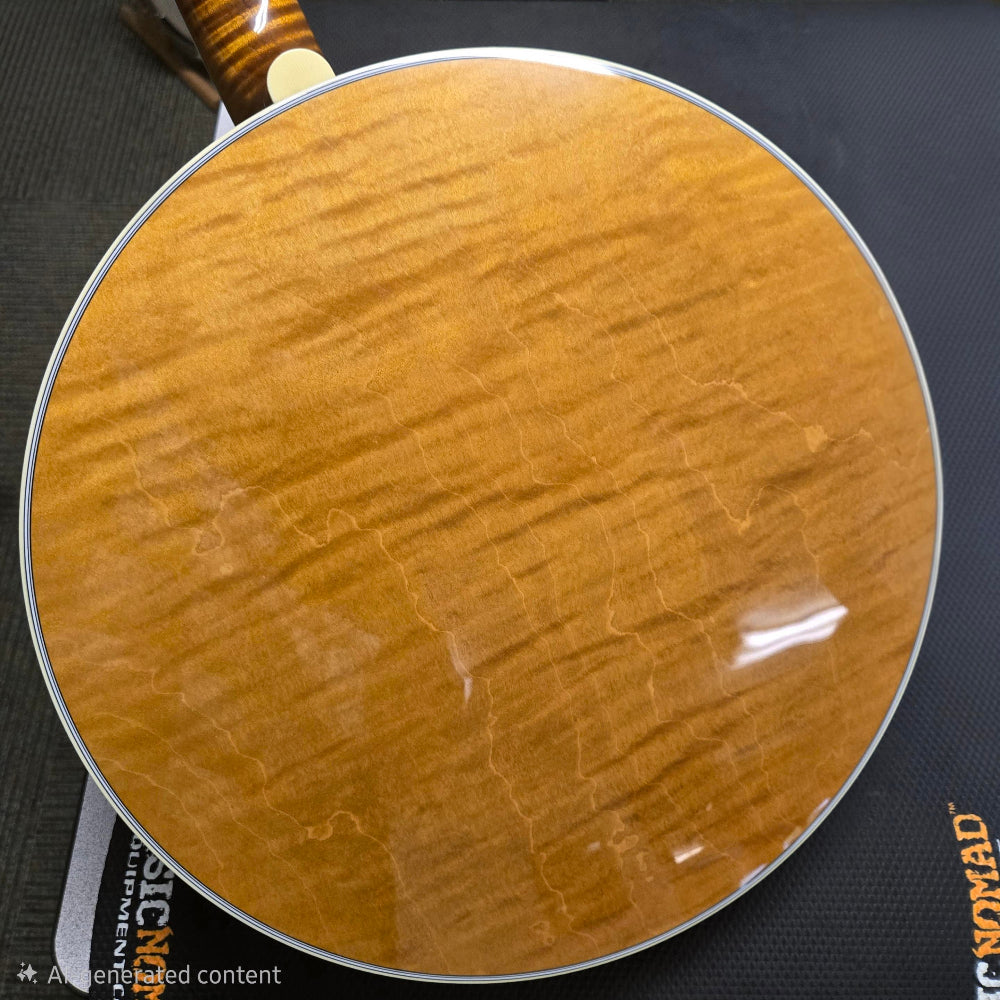 Close-up of a wooden paddle with a brand label on a dark background