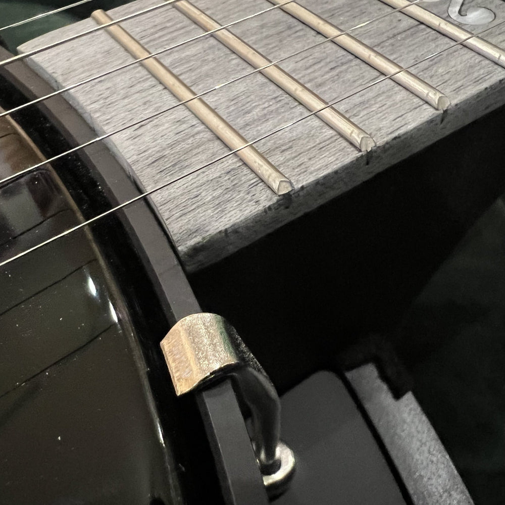 close up of fingerboard with slight chip and fill.