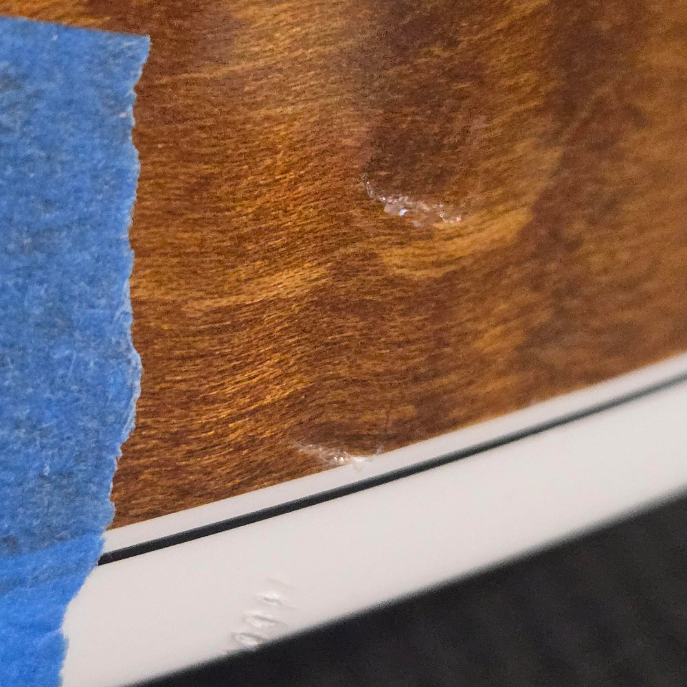 curly maple stained wood with damage. damage is screw imprint