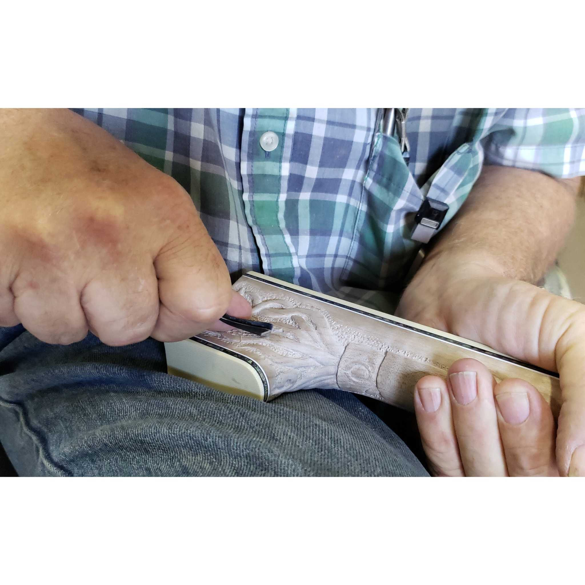 Nemo 20,000 leagues under the sea themed banjo Greg Deering doing the heel carving of a squid