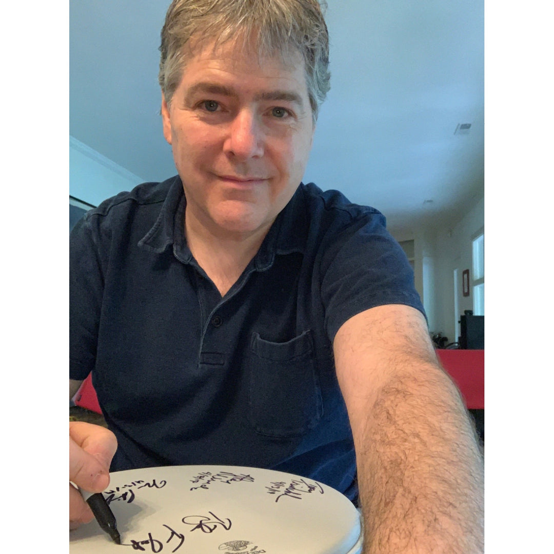Bela Fleck signing the Deering Banjo Head  2019