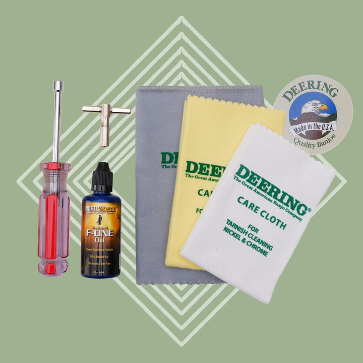 Deering Banjo Care Package, all three care cloths, one Deering round eagle logo sticker, one tr wrench, one f-one oil, one t wrench, on green background