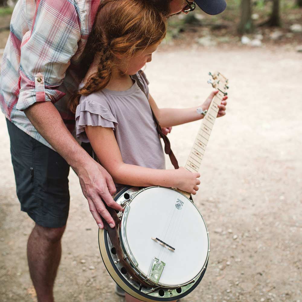Father and daughter with a Deering Goodtime Two banjo